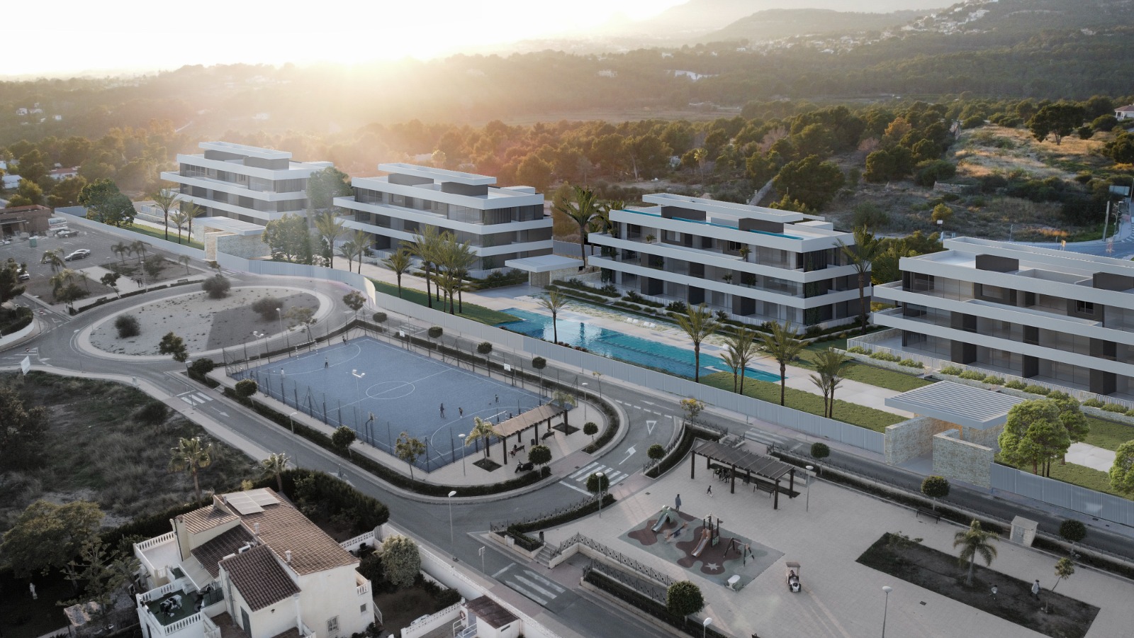 Vista aerea di Residencial Puerto Azul, La Nucía: appartamenti di nuova costruzione disposti intorno a una piscina condominiale, con impianti sportivi e ampie aree verdi nelle vicinanze.