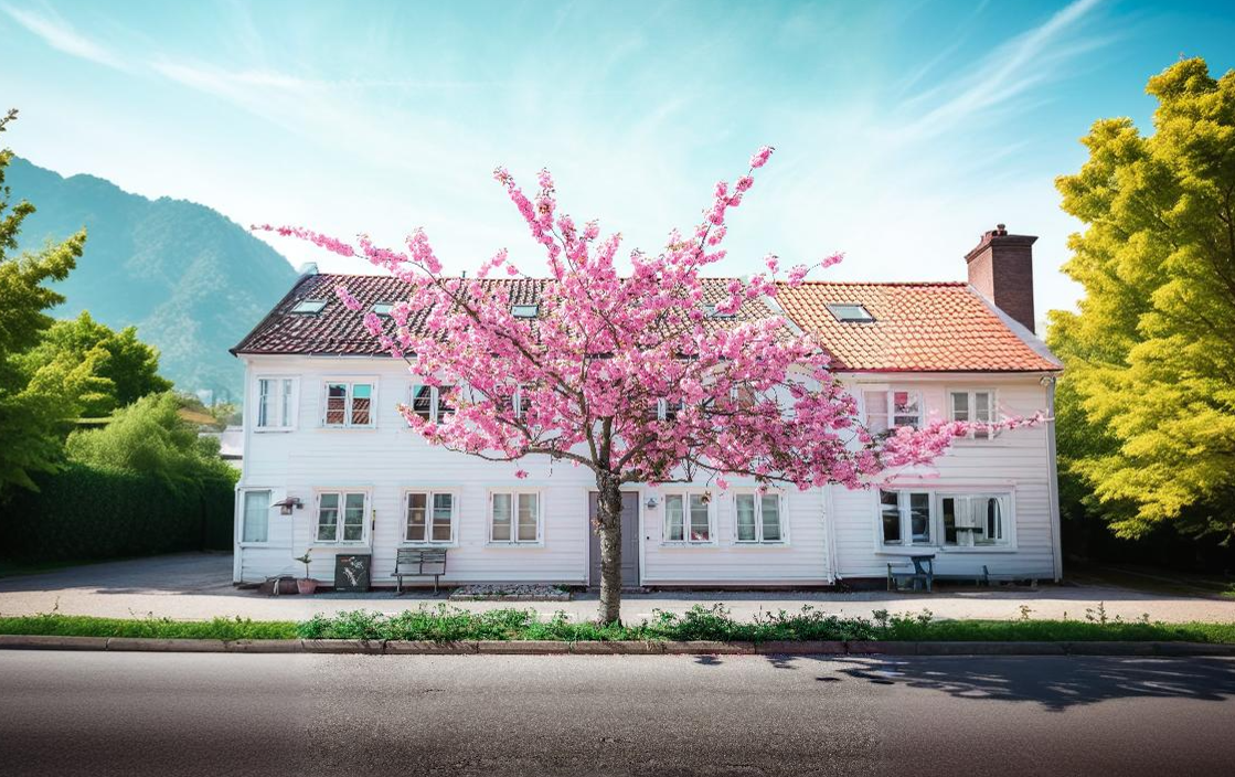 Casa com árvore rosa